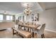 Elegant dining room with a rustic table, bench seating and ocean views at 8500 Margate Circle # 2704, Myrtle Beach, SC 29572