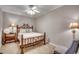 Cozy bedroom with a bamboo bed frame and a ceiling fan at 8500 Margate Circle # 2704, Myrtle Beach, SC 29572