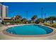 Community pool with plenty of lounge chairs at 8500 Margate Circle # 2704, Myrtle Beach, SC 29572