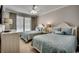 Guest bedroom with two twin beds and large windows at 8500 Margate Circle # 2704, Myrtle Beach, SC 29572
