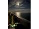 Night time view of the ocean with city lights in the background at 8500 Margate Circle # 2704, Myrtle Beach, SC 29572