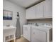 Convenient laundry room with washer, dryer, and cabinets at 8500 Margate Circle # 2704, Myrtle Beach, SC 29572