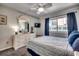 Bright bedroom with a queen bed, dresser, and TV at 814 N Waccamaw Dr. # 311, Garden City Beach, SC 29576