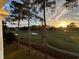 Scenic sunset view over the golf course from a balcony at 4878 Luster Leaf Circle # 404, Myrtle Beach, SC 29577