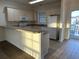Kitchen with light cabinets, and breakfast bar at 4878 Luster Leaf Circle # 404, Myrtle Beach, SC 29577