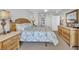 Spacious bedroom with a king-size bed and wicker furniture at 1401 S S Ocean Blvd. # 703, North Myrtle Beach, SC 29582