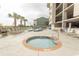 Community hot tub with surrounding lounge chairs at 1401 S S Ocean Blvd. # 703, North Myrtle Beach, SC 29582