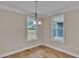 Breakfast nook with hardwood floors and two windows offering natural light at 550 Wagon Wheel Trail, Calabash, NC 28467