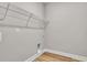 Laundry room with wire shelving and built-in pet door at 550 Wagon Wheel Trail, Calabash, NC 28467