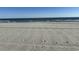 Scenic beach view with ocean waves at 700 N Waccamaw Dr. # 319, Garden City Beach, SC 29576
