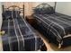 Bedroom with two beds and blue bedding; one twin bed and one double bed at 700 N Waccamaw Dr. # 319, Garden City Beach, SC 29576