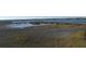 Picturesque marsh landscape with wooden walkway at 700 N Waccamaw Dr. # 319, Garden City Beach, SC 29576