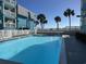 Refreshing community pool with surrounding patio at 700 N Waccamaw Dr. # 319, Garden City Beach, SC 29576