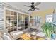 Bright and airy sunroom with a hanging chair and view to kitchen at 712 Pietras Ct., Murrells Inlet, SC 29576