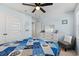 Bright bedroom with a queen-size bed and double doors leading to the bathroom at 1099 Saltgrass Way, Myrtle Beach, SC 29588