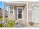 Inviting front entrance with a wreath and stone pathway at 1099 Saltgrass Way, Myrtle Beach, SC 29588