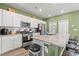 Modern kitchen with granite countertops and stainless steel appliances at 1099 Saltgrass Way, Myrtle Beach, SC 29588