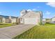 Two-car garage and well-maintained landscaping at 1099 Saltgrass Way, Myrtle Beach, SC 29588