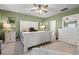 Spacious main bedroom with a large bed, dresser, and ceiling fan at 1099 Saltgrass Way, Myrtle Beach, SC 29588