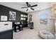 Functional home office with a desk, shelving, and comfortable seating at 1099 Saltgrass Way, Myrtle Beach, SC 29588