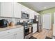 Modern kitchen with granite countertops and stainless steel appliances at 1099 Saltgrass Way, Myrtle Beach, SC 29588