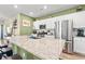 Modern kitchen with granite countertops and stainless steel appliances at 1099 Saltgrass Way, Myrtle Beach, SC 29588