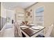 Bright dining room with farmhouse style table and chairs at 1099 Saltgrass Way, Myrtle Beach, SC 29588