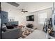 Cozy bonus room featuring a comfortable sectional sofa and large TV at 1099 Saltgrass Way, Myrtle Beach, SC 29588