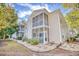 Two-story condo building with screened porches and landscaping at 5102 Sweetwater Blvd., Murrells Inlet, SC 29576