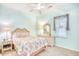 Light and airy bedroom with wicker furniture and a ceiling fan at 5102 Sweetwater Blvd., Murrells Inlet, SC 29576