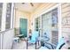 Relaxing screened porch with rocking chairs and outdoor seating at 5102 Sweetwater Blvd., Murrells Inlet, SC 29576