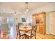 Charming dining area with round wooden table and four chairs at 5102 Sweetwater Blvd., Murrells Inlet, SC 29576