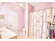 Pink bathroom with shower/tub combo and a white vanity at 5102 Sweetwater Blvd., Murrells Inlet, SC 29576