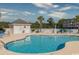 Community swimming pool with lounge chairs and a nearby restroom facility at 4878 Dahlia Ct. # 24-304, Myrtle Beach, SC 29577