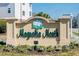 Magnolia North community entrance sign with landscaping at 4878 Dahlia Ct. # 24-304, Myrtle Beach, SC 29577