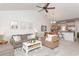 Open living space with cozy seating and a view into the kitchen at 4878 Dahlia Ct. # 24-304, Myrtle Beach, SC 29577