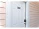 White front door with keypad entry at 304 at 4878 Dahlia Ct. # 24-304, Myrtle Beach, SC 29577