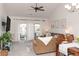 Spacious living area featuring ample seating and access to a balcony at 4878 Dahlia Ct. # 24-304, Myrtle Beach, SC 29577