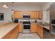 Modern kitchen with stainless steel appliances and light wood cabinets at 4878 Dahlia Ct. # 24-304, Myrtle Beach, SC 29577