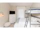 Bedroom with bunk beds, dresser, and TV at 4878 Dahlia Ct. # 24-304, Myrtle Beach, SC 29577