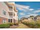 Side view of building with landscaping and balconies at 4878 Dahlia Ct. # 24-304, Myrtle Beach, SC 29577