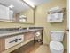 Clean bathroom with granite countertop, large mirror, and shower/tub combo at 2311 S Ocean Blvd. # 139, Myrtle Beach, SC 29577