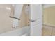 Bathroom with shower/tub, grab bar, and white tile flooring at 2311 S Ocean Blvd. # 139, Myrtle Beach, SC 29577