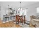 Dining area with wood table and chairs, adjacent to the kitchen at 612 River Oaks Dr. # 55D, Myrtle Beach, SC 29579