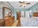 King-size bed, dresser, and ocean-themed wall art at 612 River Oaks Dr. # 55D, Myrtle Beach, SC 29579