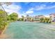 Green tennis court with surrounding landscaping at 612 River Oaks Dr. # 55D, Myrtle Beach, SC 29579