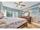 King-size bed, dresser, and beach mural in a bright room at 612 River Oaks Dr. # 55D, Myrtle Beach, SC 29579