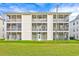 Building exterior showcasing multiple screened balconies at 612 River Oaks Dr. # 55D, Myrtle Beach, SC 29579