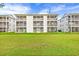 Condo building exterior with screened balconies and grassy yard at 612 River Oaks Dr. # 55D, Myrtle Beach, SC 29579