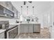 Modern kitchen with stainless steel appliances and gray cabinets at 612 River Oaks Dr. # 55D, Myrtle Beach, SC 29579